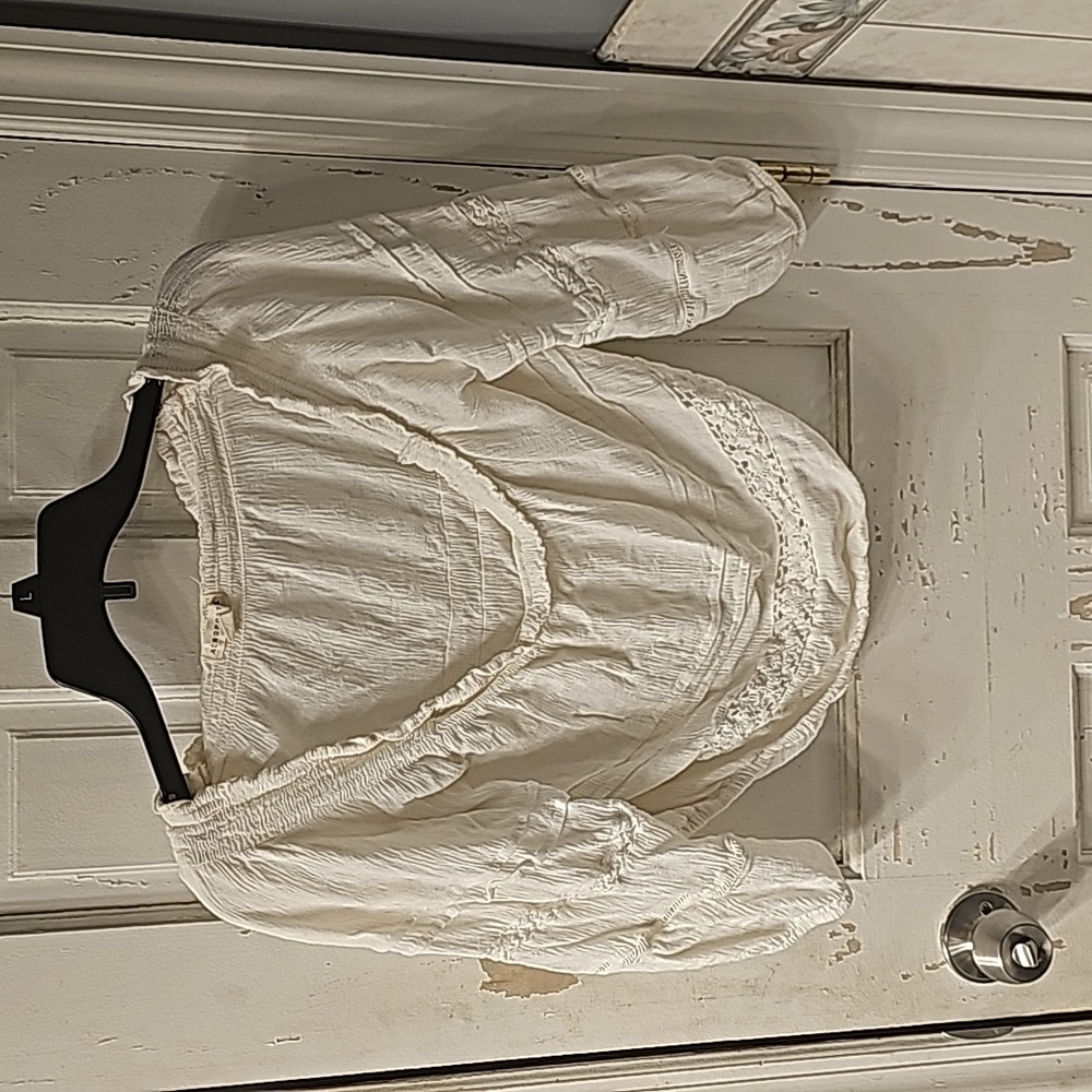 A cropped off the shoulder shirt